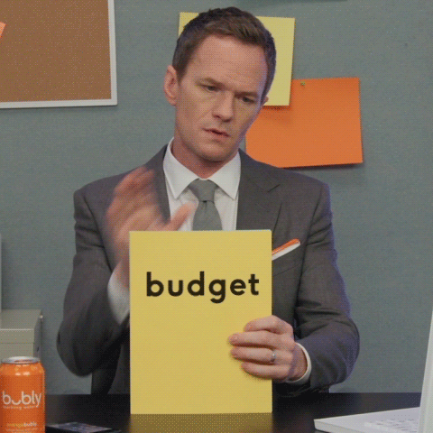 man throwing paper with budget written
